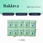 A pack of ten single sachet servings of Baklava flavored meal replacement shakes by Daily Shake, displaying nutritional information such as 206 calories, 25g protein, and 4g fibre.
